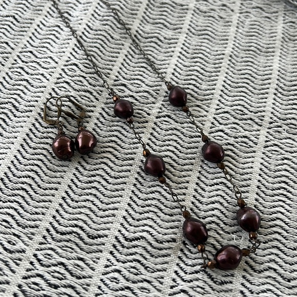 Matching earrings and necklace with gold tone beads and burgundy beads. - Picture 1 of 6